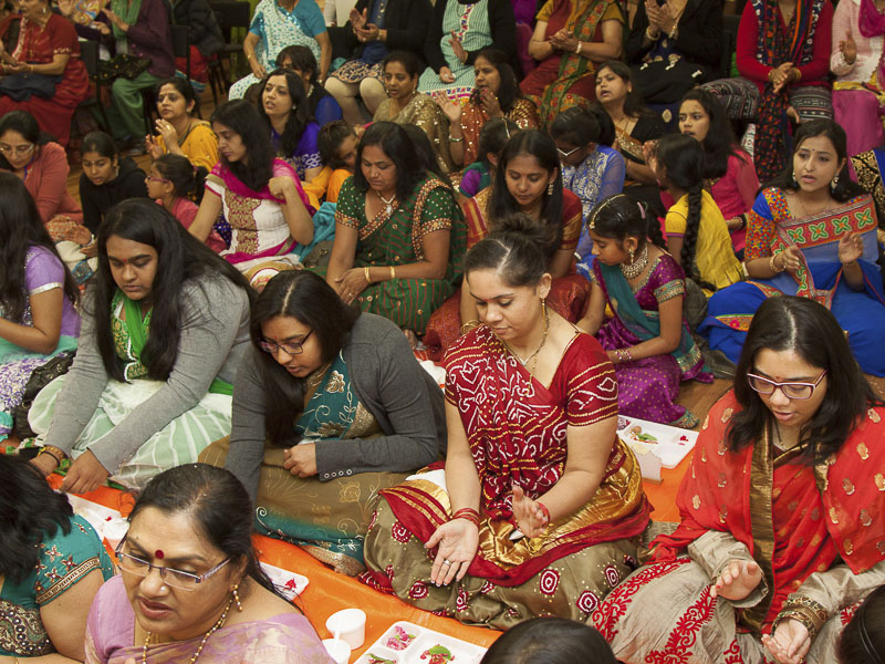 Devotees participate in murti-pratishtha mahapuja