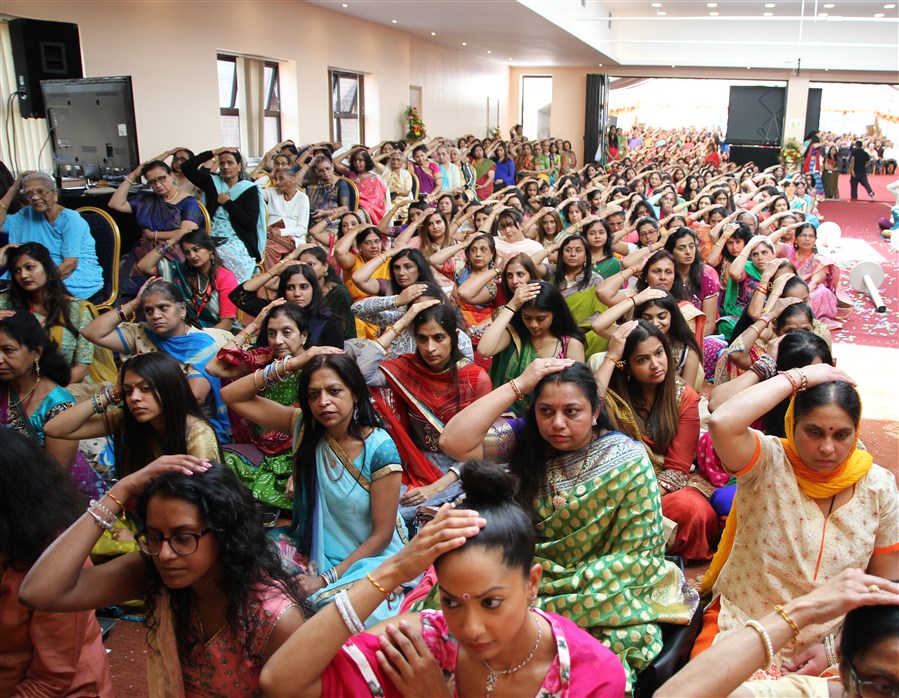 Devotees participate in the mandir inauguration mahapuja