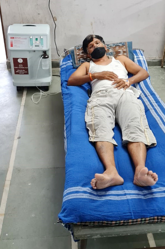 A patient at Bhavya Covid Healthcare Centre in Borsad is already benefiting from the oxygen concentrator donated by BAPS UK